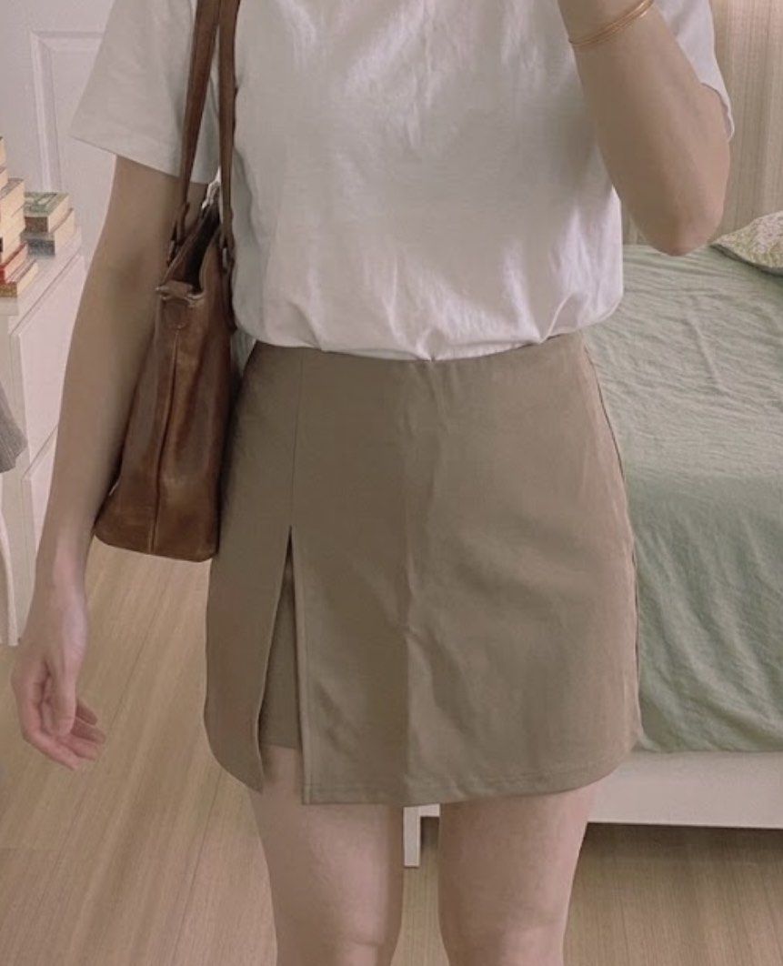 SHEIN Tan/Khaki Overlapping Asymmetric Skort (Size M) (Category: Skirts) located in Muntinlupa City. Submitted by alexisofia (Listing ID 1466733269, Image 1). Description: Super cute and versatile tan/khaki skort featuring an overlapping, asymmetrical wrap-around front panel with a stylish side split—giving you the effortless look of a skirt with the comfort and coverage of built-in shorts. like new / excellent condition (worn only a few times) M