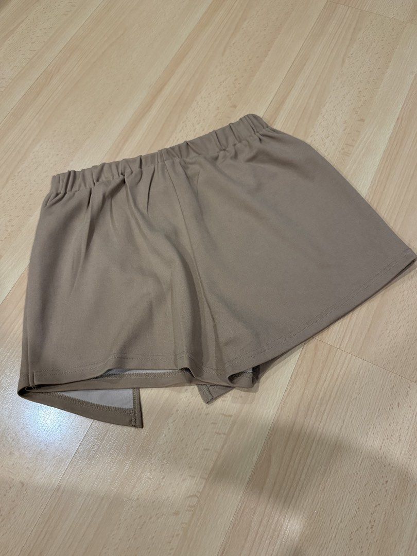 SHEIN Tan/Khaki Overlapping Asymmetric Skort (Size M) (Category: Skirts) located in Muntinlupa City. Submitted by alexisofia (Listing ID 1466733269, Image 3). Description: Super cute and versatile tan/khaki skort featuring an overlapping, asymmetrical wrap-around front panel with a stylish side split—giving you the effortless look of a skirt with the comfort and coverage of built-in shorts. like new / excellent condition (worn only a few times) M