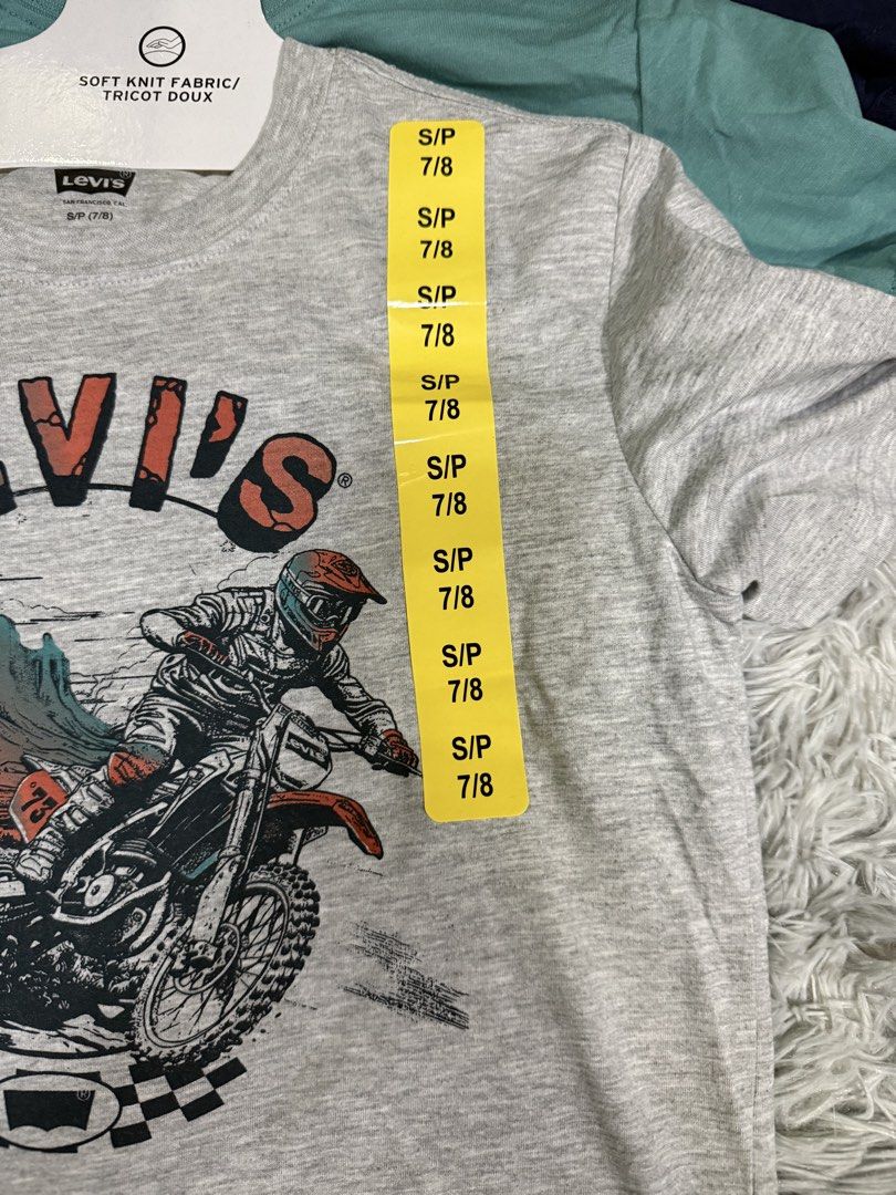 Shirt for Kids (Category: Babies & Kids Fashion) located in Muntinlupa City. Submitted by avampaya (Listing ID 1466688343, Image 2). Description: Youth 3-pack t-shirts from Levi's 3 colors: grey with dirt bike graphic, green, and navy blue. Size S, fits ages 7 to 8 years old. .