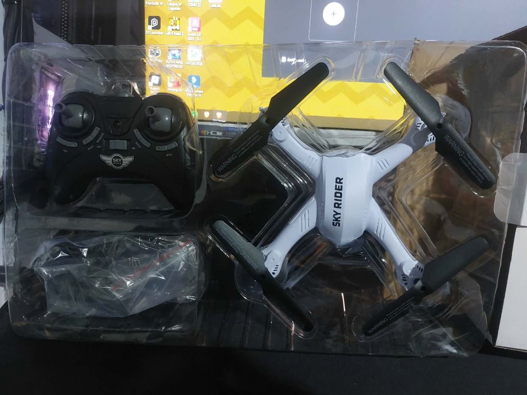 Sky Rider X-31 Shockwave Quadcopter Drone (Category: Drones) located in Caloocan City. Submitted by shinkiro1218 (Listing ID 1466564493, Image 3). Description: - Model: Sky Rider X-31 Shockwave quadcopter drone - Features: Built-in Wi-Fi camera for aerial viewing - Design: White body with black blades and protective guards - Condition: Brand new, unopened plastic packaging inside original box - Includes: Remote controller and all original accesso
