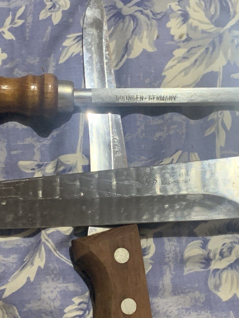 Solingen Wooden Knife with stand (Category: Knives & Chopping Boards) located in Manila. Submitted by vrsd1027 (Listing ID 1466697025, Image 3). Description: - Complete set: Includes a solid wooden knife block, several kitchen knives, and a sharpener rod - Premium quality: Features genuine steel blades marked Solingen Germany - Durable build: Classic wooden handles securely fastened with rivets - Authentic character: Blades show natural patina, s