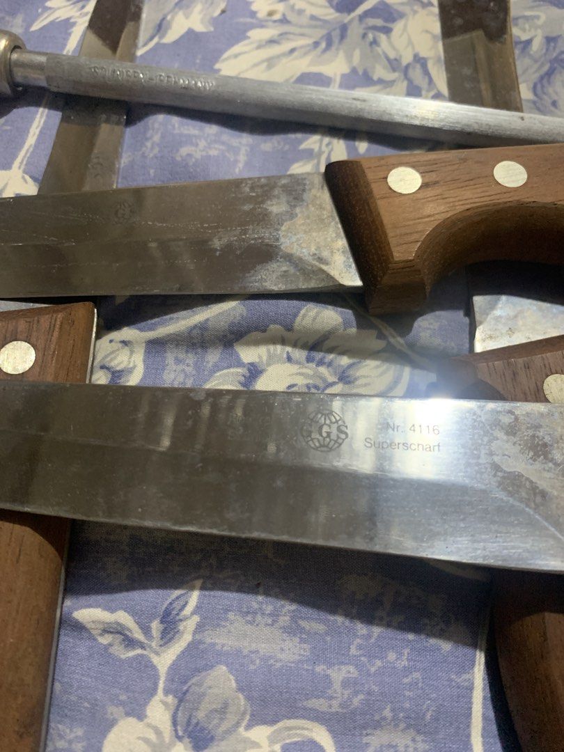 Solingen Wooden Knife with stand (Category: Knives & Chopping Boards) located in Manila. Submitted by vrsd1027 (Listing ID 1466697025, Image 2). Description: - Complete set: Includes a solid wooden knife block, several kitchen knives, and a sharpener rod - Premium quality: Features genuine steel blades marked Solingen Germany - Durable build: Classic wooden handles securely fastened with rivets - Authentic character: Blades show natural patina, s
