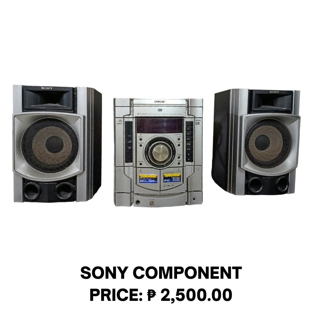 Sony Component Stereo System with Speakers (Category: Soundbars, Speakers & Amplifiers) located in Manila. Submitted by jjwebshop2026 (Listing ID 1466569106, Image 1). Description: - Brand: Sony Component Stereo System - Includes: Main unit and two matching speakers - Design: Stylish silver and black finish with a massive center volume knob and digital display - Features: Dual cassette decks and a built-in DVD player section - Performance: Heavy-