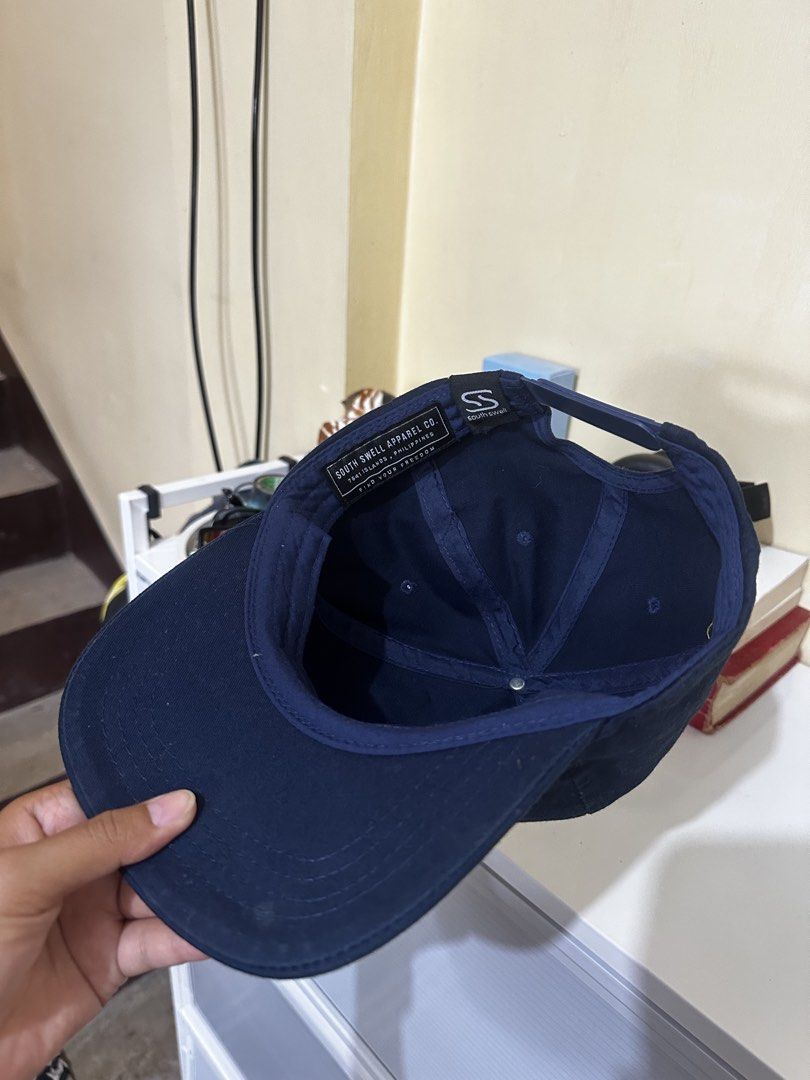 South Swell Apparel Navy Blue Cap (Category: Caps & Hats) located in Baler. Submitted by sidequester (Listing ID 1466575098, Image 3). Description: - Brand: South Swell Apparel - Color: Navy blue - Fit: Adjustable strap closure at the back - MOP: Any online bank or e-wallets - MOD: Can do meet up and ship nationwide - Can offer discount or bundle price for hats.