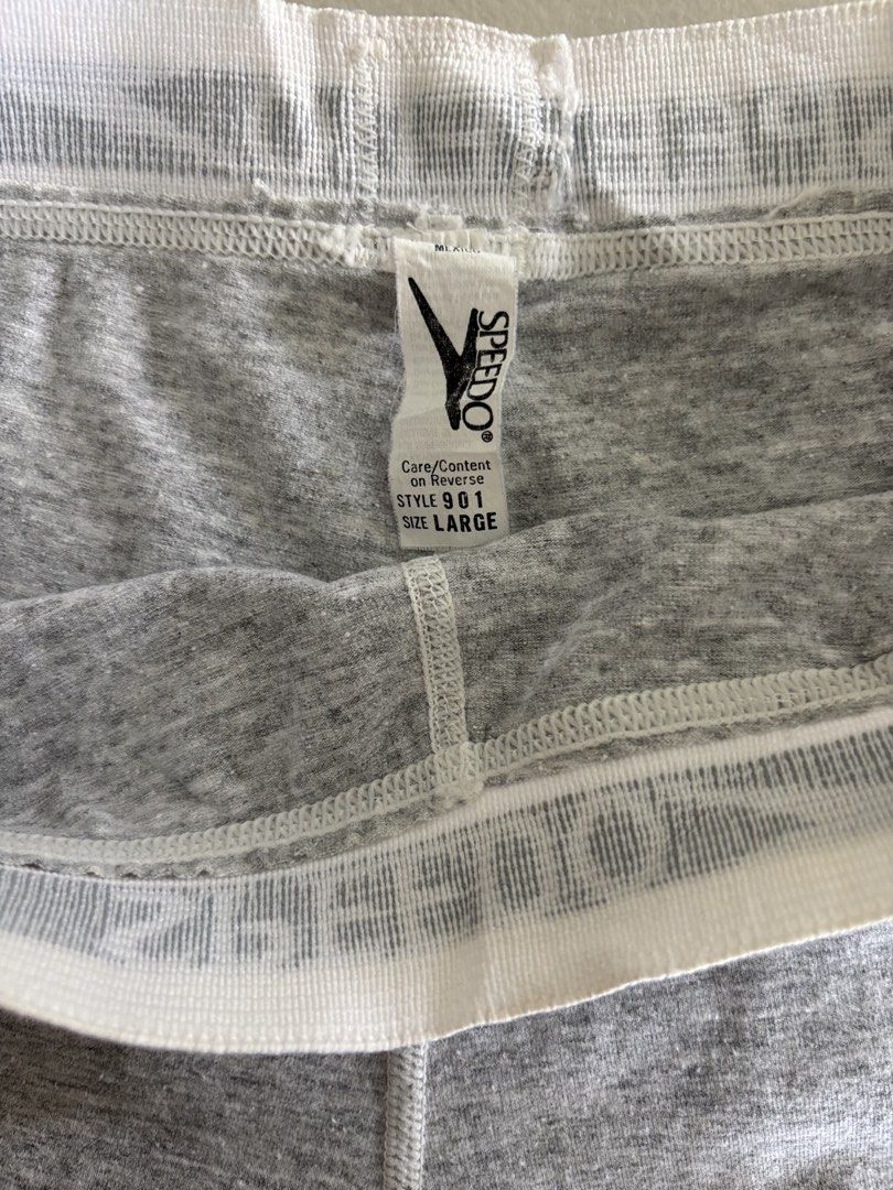 Speedo Style 901 Grey Boxer Shorts (Category: Activewear) located in Iloilo. Submitted by oddforest.c9c7d5 (Listing ID 1466742899, Image 2). Description: - Brand: Speedo (Style 901) - Size: Small(Large on tag) - Color: Grey - Material: Soft cotton blend - Design: Elastic waistband with all-over printed Speedo text, mid-thigh length - Condition: Clean, no tears or stains.