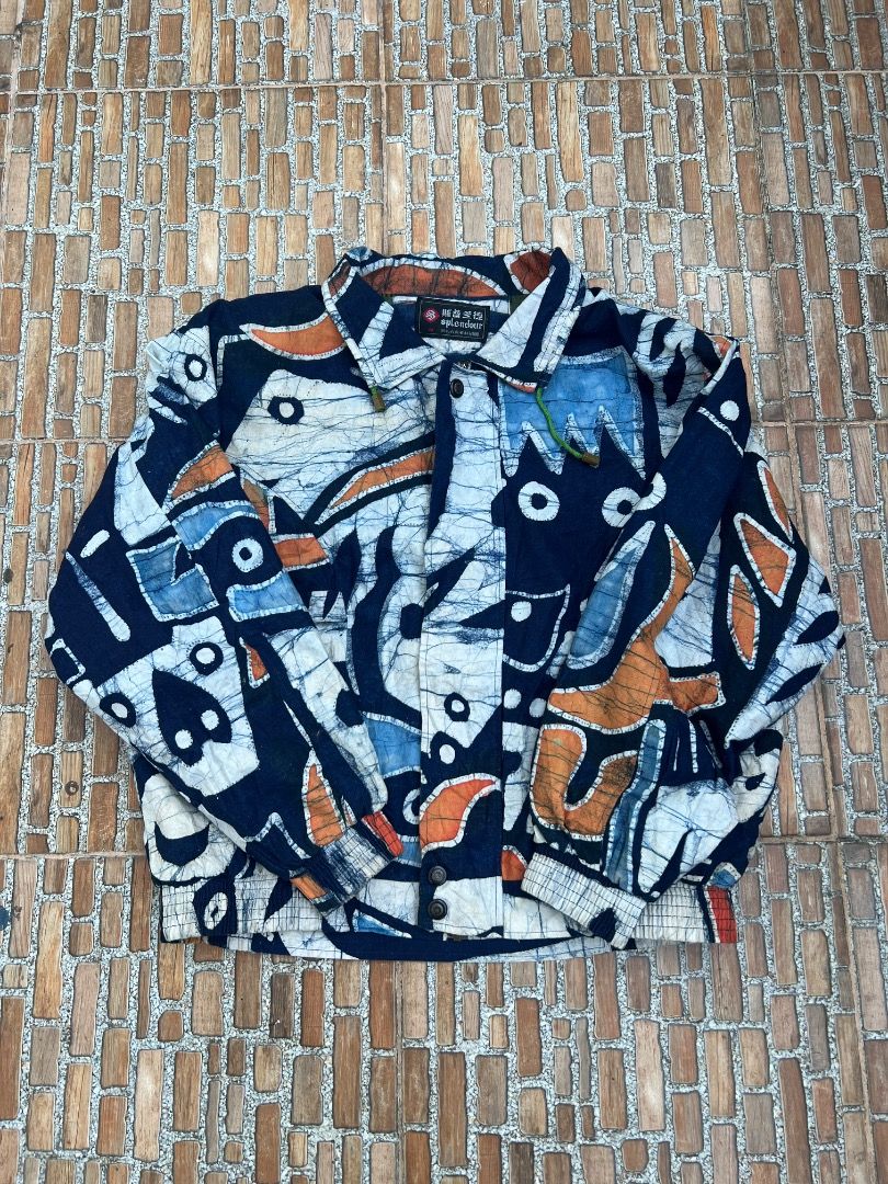 Splendour Abstract Print Bomber Jacket Size M (Category: Coats, Jackets and Outerwear) located in Caloocan City. Submitted by sillapwet0606 (Listing ID 1466564629, Image 1). Description: - Brand/Model: Splendour jacket - Size: Medium (M) - Design: Dark blue base with heavy white and orange abstract art patterns - Interior: Vibrant green lining inside the body and Chinese text on the brand tag - Features: Elastic hem and cuffs for a comfortable fi