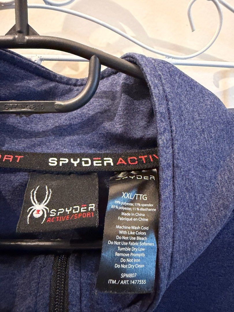 Spyder Active Sport 1/4 Zip Pullover Blue XXL (Category: Coats, Jackets and Outerwear) located in Quezon City. Submitted by bubspreloved (Listing ID 1466703858, Image 3). Description: - Brand: Spyder Active Sport - Style: Quarter-zip pullover with stand-up collar - Color: Blue with black side panels - Size: XXL - Material: 89% polyester, 11% spandex for a comfortable stretch - Details: Embroidered spider logo on chest and branding on back collar 