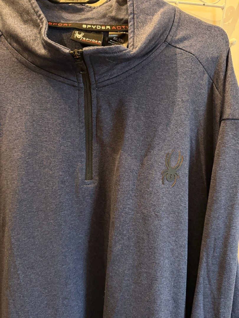 Spyder Active Sport 1/4 Zip Pullover Blue XXL (Category: Coats, Jackets and Outerwear) located in Quezon City. Submitted by bubspreloved (Listing ID 1466703858, Image 2). Description: - Brand: Spyder Active Sport - Style: Quarter-zip pullover with stand-up collar - Color: Blue with black side panels - Size: XXL - Material: 89% polyester, 11% spandex for a comfortable stretch - Details: Embroidered spider logo on chest and branding on back collar 