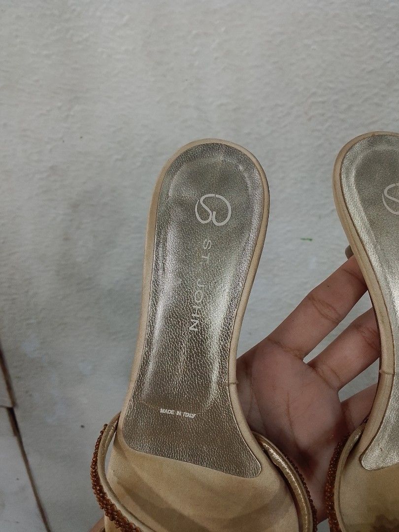 St. John Beaded Strappy Kitten Heels (Category: Heels) located in Caloocan City. Submitted by mayn_della (Listing ID 1466698040, Image 3). Description: - Brand/Origin: St. John, Made in Italy - Size: 5.5 - Material: Nude satin upper, gold metallic insoles, Vero Cuoio leather soles - Design: Brown beaded criss-cross toe straps with a knotted bow accent, shiny gold kitten heels - Condition: Pre-owned; noticeable discoloration and staining on the fo