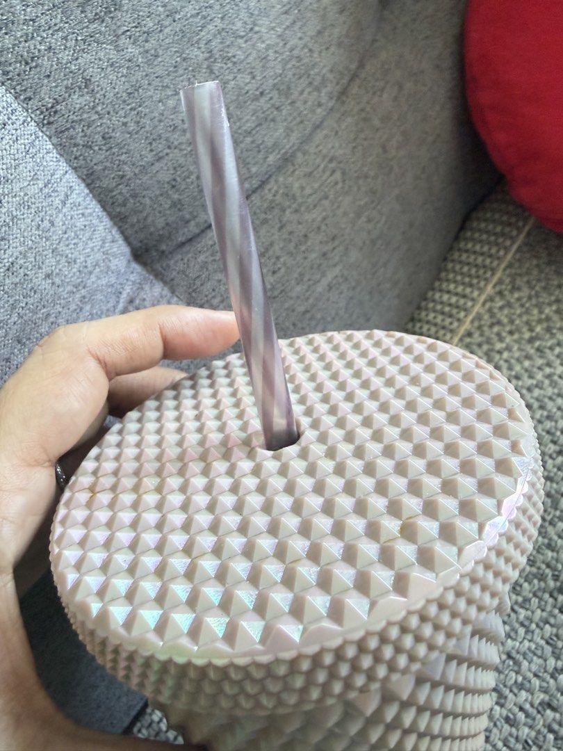 Starbucks Studded Cold Cup (Category: Water Bottles & Tumblers) located in Manila. Submitted by mal.eficent (Listing ID 1466630132, Image 3). Description: -100% Authentic Starbucks studded tumbler in a gorgeous Rose Gold color -Holographic effect - Capacity: 16 fl oz / 473 ml (Grande size) - Textured geometric design all over the cup and matching striped straw - Includes secure matching lid - Care instructions: For cold beverages only, hand wash 