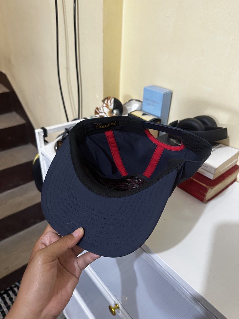 Stardust Navy Blue Cap (Category: Caps & Hats) located in Baler. Submitted by sidequester (Listing ID 1466574865, Image 3). Description: - Navy Blue Stardust cap with a round galaxy graphic patch - Detail: Classic rope accent across the brim base - Interior: Navy blue panels with red taped seams and branded sweatband tag - Fit: Clean, structured shape made from lightweight fabric - MOP: Any online bank or e-wallets - MOD: Can do meet up and ship 
