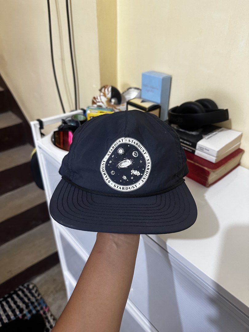 Stardust Navy Blue Cap (Category: Caps & Hats) located in Baler. Submitted by sidequester (Listing ID 1466574865, Image 1). Description: - Navy Blue Stardust cap with a round galaxy graphic patch - Detail: Classic rope accent across the brim base - Interior: Navy blue panels with red taped seams and branded sweatband tag - Fit: Clean, structured shape made from lightweight fabric - MOP: Any online bank or e-wallets - MOD: Can do meet up and ship 
