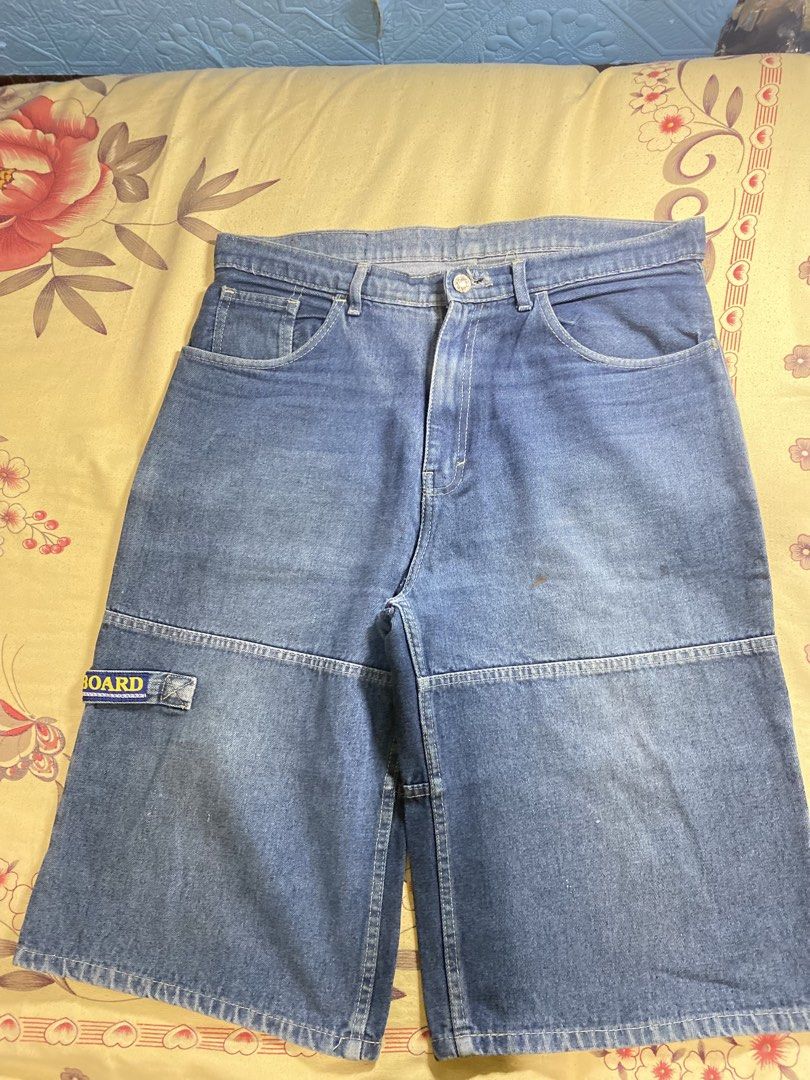 Stone Board Denim Jeans (Category: Jeans) located in Bacolor. Submitted by paw_thrift (Listing ID 1466690108, Image 3). Description: - Brand: Stone Board - Color/Wash: Mid wash blue denim with natural fading - Details: Stylish leg panels, back pockets with woven logo, and small badge on right leg pocket - Closure: Classic button and zip fly - Condition: Pre-owned with great vintage appeal.