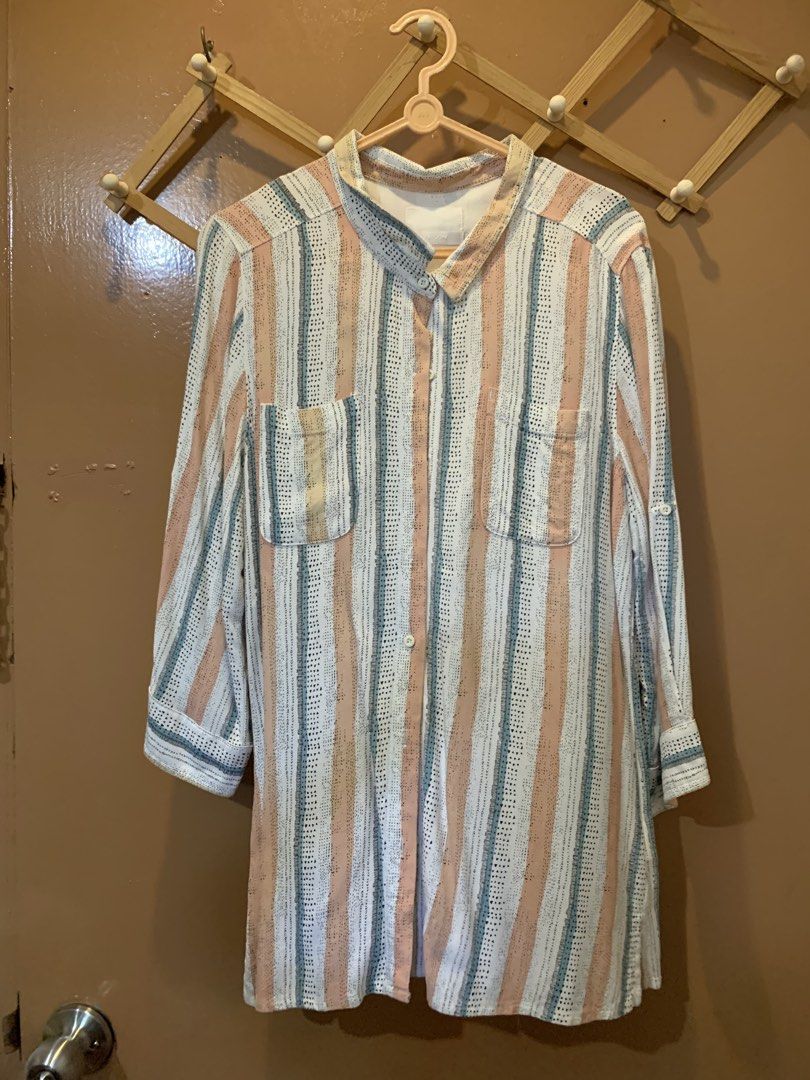 Striped Button-Down Long Sleeve Shirt M (Category: Longsleeves) located in Las Pinas. Submitted by mscandicestarry (Listing ID 1466618307, Image 1). Description: - Brand: BOBSON - Design: White base with peach and teal vertical stripes and small black geometric patterns - Features: Collared neckline, button-up front, two chest pockets, and long sleeves with roll-up tabs - Fit: Relaxed fit, lightweight fabric - Condition: Clean collar, all buttons