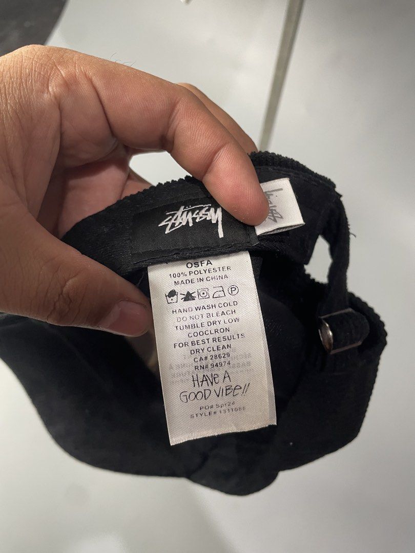 Stüssy Black Corduroy Cap (Category: Caps & Hats) located in Veruela. Submitted by blinkban_thrift (Listing ID 1466575791, Image 3). Description: - Brand: Stüssy - Style: Black corduroy hat with white embroidered logo - Collection: Spring '24 (Style #1311088) - Material: 100% polyester - Fit: One size fits all with adjustable strap closure - Condition: Clean all around, excellent pre-loved condition.