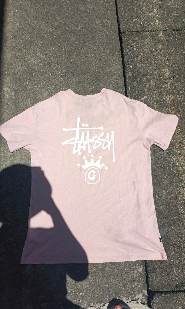 Stüssy Tee, Washed Pink, Crown Back Print (Category: Activewear) located in Canlaon. Submitted by thriftytrift (Listing ID 1466597031, Image 3). Description: The faded pink look comes from the wash, so it may look slightly different in person. Dimes:22/30 condition:8/10 cr:8/10.