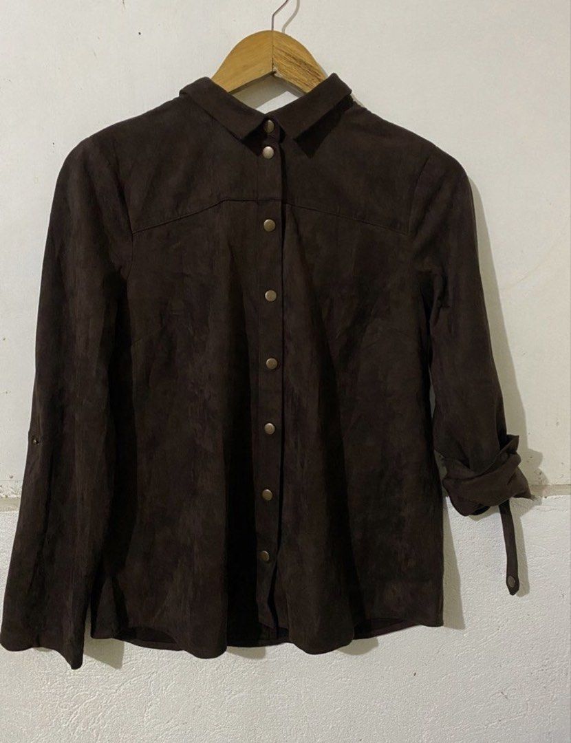 Suede Button-Up Shirt (Category: Shirts) located in Naga. Submitted by cozydapper (Listing ID 1466627207, Image 1). Description: Length - 23 inches Width - 19 inches - Brand: V. Lane - Color: Rich dark brown - Material: Smooth suede-feel fabric - Design: Classic collar and metallic button-up front - Sleeves: Long with button-secured roll-up tabs - Styling: Great for layering or standalone wear in cooler weather.