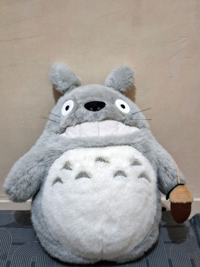 Sun Arrow Studio Ghibli Totoro plush backpack (Category: Plushies & Soft Toys) located in Cebu City. Submitted by __sen (Listing ID 1466754931, Image 1). Description: - Authentic Sun Arrow Studio Ghibli Grey Totoro plush backpack - Features Totoro holding an acorn with a big round chevron-marked belly - Super soft, huggable fur makes it a great cuddle buddy - Comes with original tag (Sun Arrow) - Perfect gift for Ghibli fans and collectors.