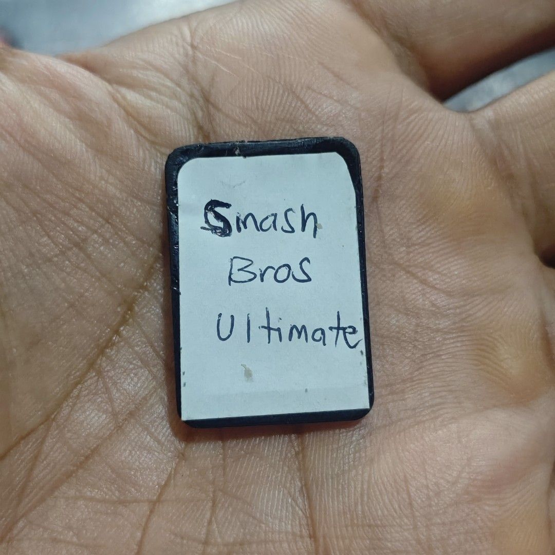 Super Smash Bros Ultimate Switch Game (Category: Nintendo) located in Quezon City. Submitted by shopme_gadget30 (Listing ID 1466612176, Image 1). Description: kindly read the details first for sale fixed price good Condition tested and working game card only compatible to Nintendo switch issue no label art and bitten by the dog but working perfectly qc area meet up: sm north shipping fee must shoulder by the buyer via lalamove or grab payment: bd