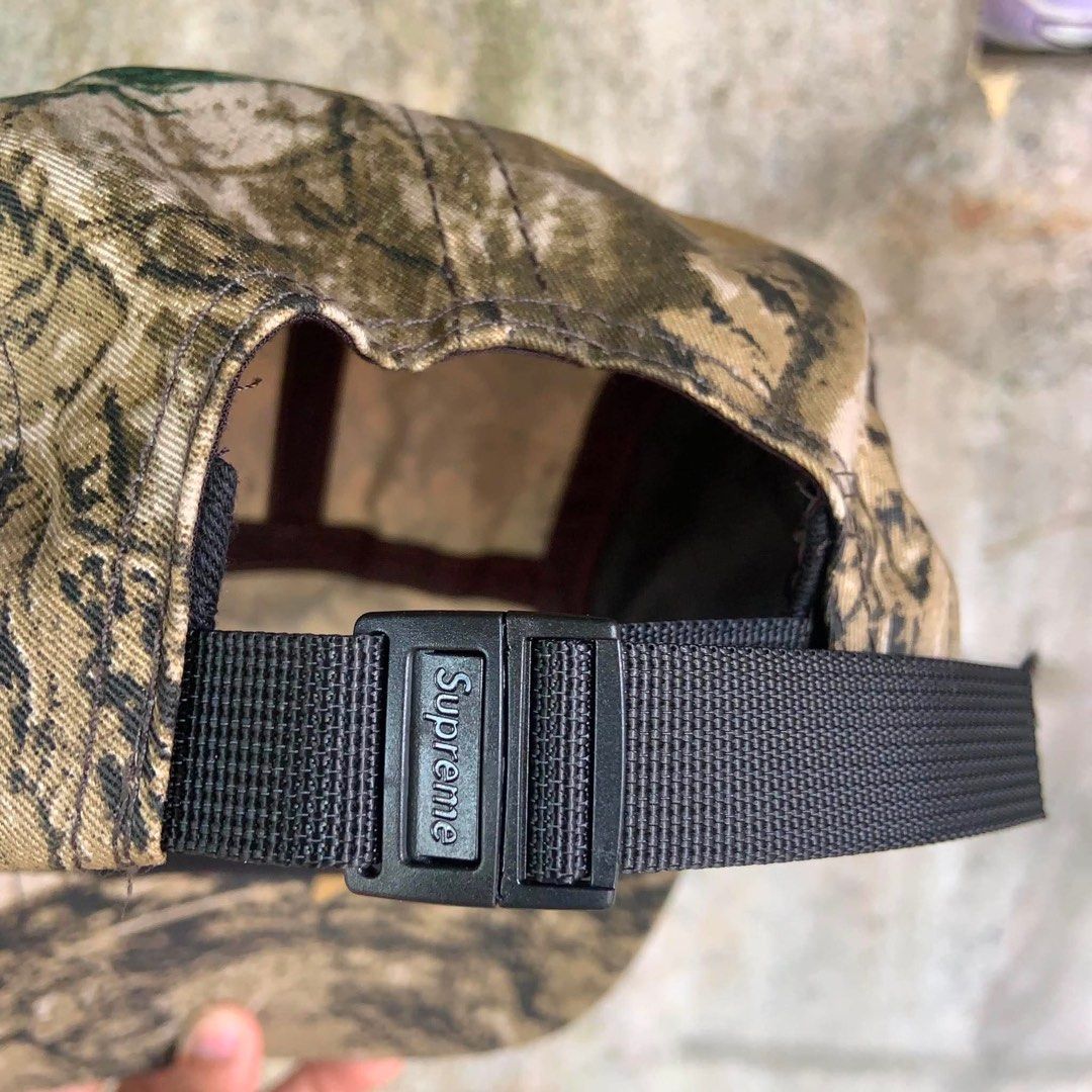 Supreme Mossy Oak Gore-Tex Camp Cap (Category: Caps & Hats) located in Mandaluyong City. Submitted by dhanlumanas (Listing ID 1466770793, Image 2). Description: - Brand: Supreme - Style: Camp Cap in Real Tree Camo with solid brown side panels - Branding: Classic box logo on front, Mossy Oak logo on one side, and Gore-Tex embroidery on the other - Closure: Adjustable strapback with Supreme-branded buckle - Size: Small/Medium - Condition: Brand new