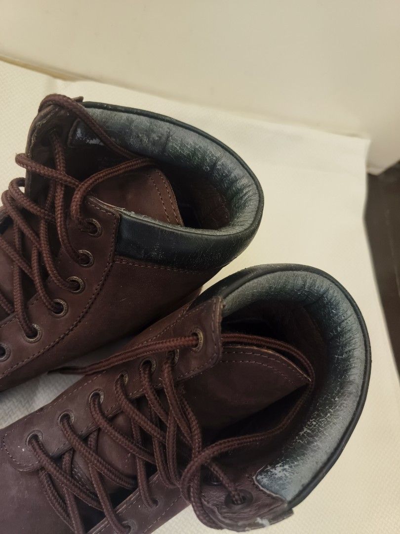 Swatch Seasider Brown Leather Boots (Category: Boots) located in Quezon City. Submitted by closetraiders.mnl (Listing ID 1466707354, Image 3). Description: - Brand: Swatch Sensider (Made in Marikina) - Size: 7.0M - Material: Genuine Brown leather - Style: Classic lace-up with sturdy construction and comfortable ankle height - Flaws: Cracking/peeling on the black padded collar, especially around the opening..