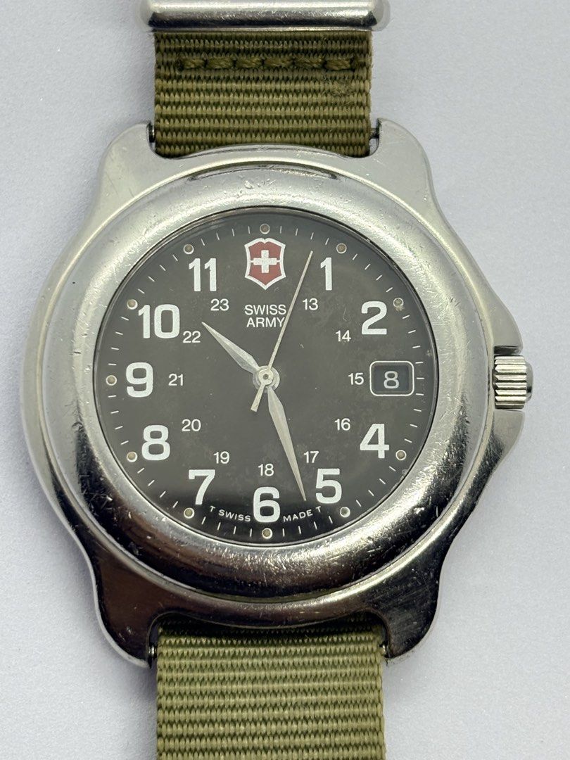 Swiss military field watch (Category: Men's Watches) located in Quezon City. Submitted by rentoti (Listing ID 1466722316, Image 1). Description: Classic Vintage 1990s Victorinox Swiss Army Officer’s Field Watch This timepiece features the iconic military aesthetic with a rare dark green dial and true vintage tritium hour markers (indicated by the original “T SWISS MADE T” stamp on the dial). Perfect for a rugged daily wear option, a classic Every