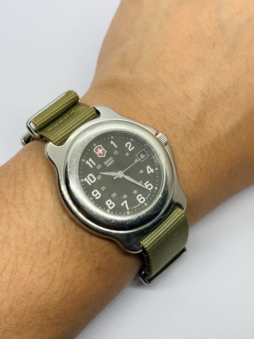 Swiss military field watch (Category: Men's Watches) located in Quezon City. Submitted by rentoti (Listing ID 1466722316, Image 3). Description: Classic Vintage 1990s Victorinox Swiss Army Officer’s Field Watch This timepiece features the iconic military aesthetic with a rare dark green dial and true vintage tritium hour markers (indicated by the original “T SWISS MADE T” stamp on the dial). Perfect for a rugged daily wear option, a classic Every