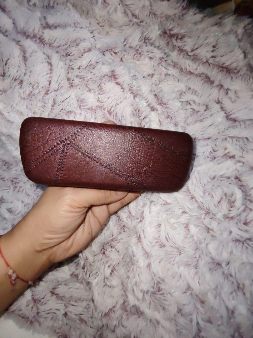 TAG Heuer Brown Leather Eyewear Case (Category: Luxury Accessories) located in Manila. Submitted by purediamond888 (Listing ID 1466758911, Image 2). Description: Brown leather glasses case from TAG Heuer. Embossed logo on front and stitched pattern detailing. Inside has a light-colored lining with the brand logo stamped on the upper lid. Snap closure keeps sunglasses or spectacles secure..
