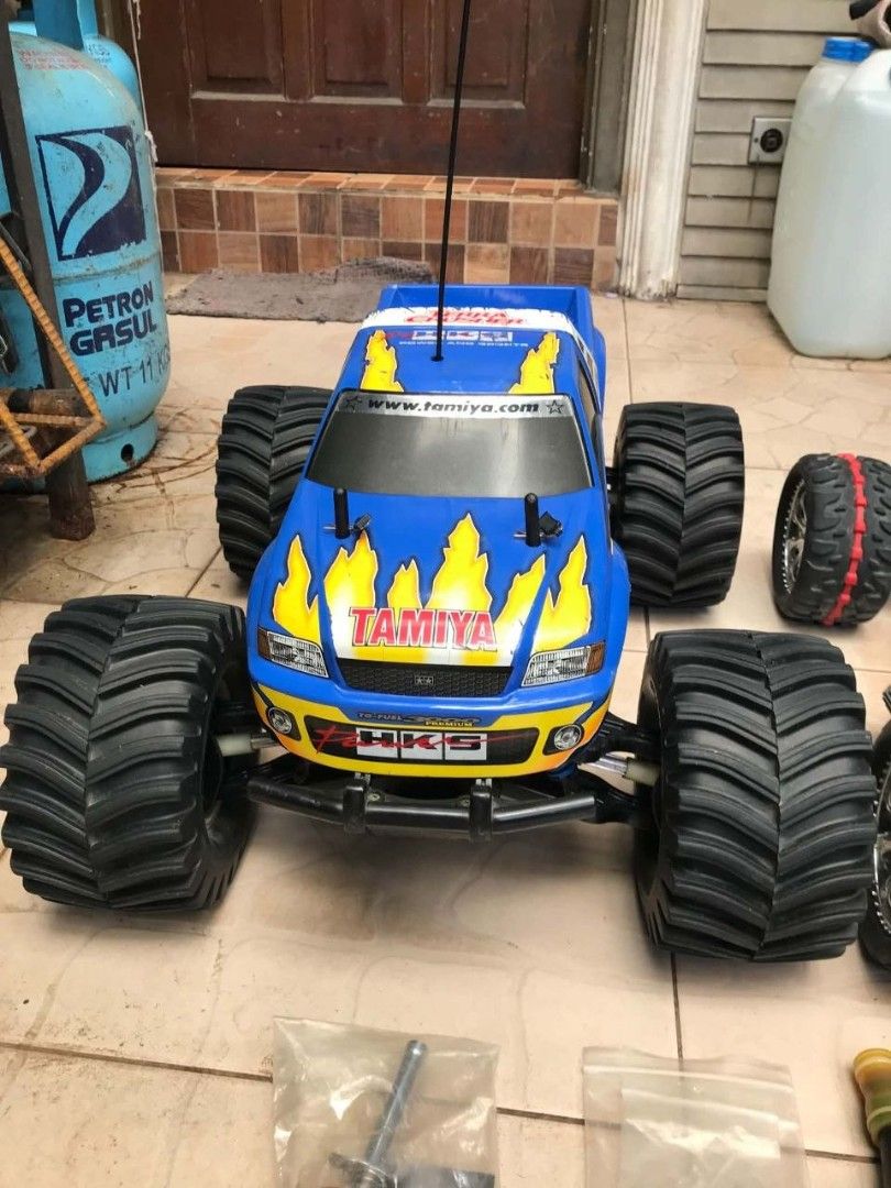 Tamiya Terra Crusher Nitro RC Monster Truck Bundle (Category: Remote Control Toys) located in Manila. Submitted by joelssalum87443 (Listing ID 1466693258, Image 2). Description: Manufactured starting in July 2002, the Tamiya Terra Crusher (TGM-02 chassis) is a flagship 1/8 scale nitro monster truck built with a blue-anodized aluminum alloy lower chassis, high-impact molded composite plastics, and heavy-duty steel drive shafts. Offered as a high-v