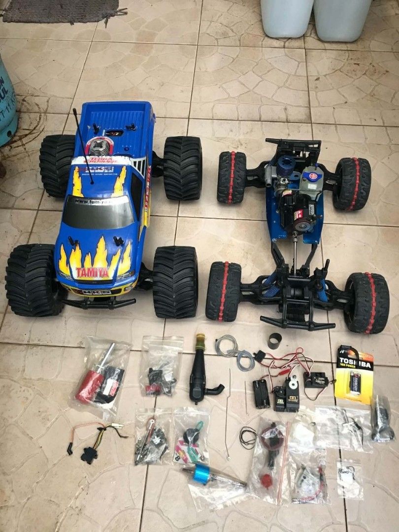 Tamiya Terra Crusher Nitro RC Monster Truck Bundle (Category: Remote Control Toys) located in Manila. Submitted by joelssalum87443 (Listing ID 1466693258, Image 1). Description: Manufactured starting in July 2002, the Tamiya Terra Crusher (TGM-02 chassis) is a flagship 1/8 scale nitro monster truck built with a blue-anodized aluminum alloy lower chassis, high-impact molded composite plastics, and heavy-duty steel drive shafts. Offered as a high-v