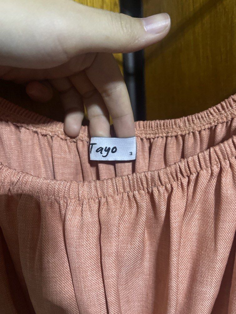 Tayo Studio Odessa Maxi Dress (Category: Dresses) located in Quezon City. Submitted by chiaramos154238 (Listing ID 1466622597, Image 2). Description: Brand: Tayo Studio Style Name: Odessa Maxi Dress Size: Size 3 (can fit L/XL/XXL) Color: Peach Features: Off-shoulder flutter sleeves, stretch smocked waistline, and a tiered maxi skirt Condition: Used once (Excellent condition) Original Price: ₱2,500 Reason for Selling (RFS): Too on me and Declutter