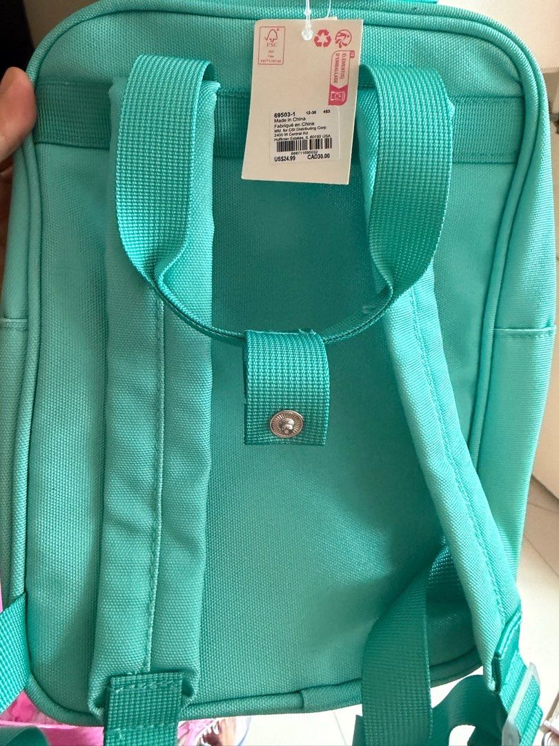 Teal Backpack with Heart Motif (Category: Babies & Kids Fashion) located in Quezon City. Submitted by bubspreloved (Listing ID 1466771077, Image 2). Description: - used once (Original US $24.99) - Color: Vibrant teal with white zipper pulls - Features a cute 'LIVE AND LOVE EVERY DAY' heart patch on the front - Practical design with adjustable straps and front zip pocket - Clean fabric construction, perfect for school or daily use.