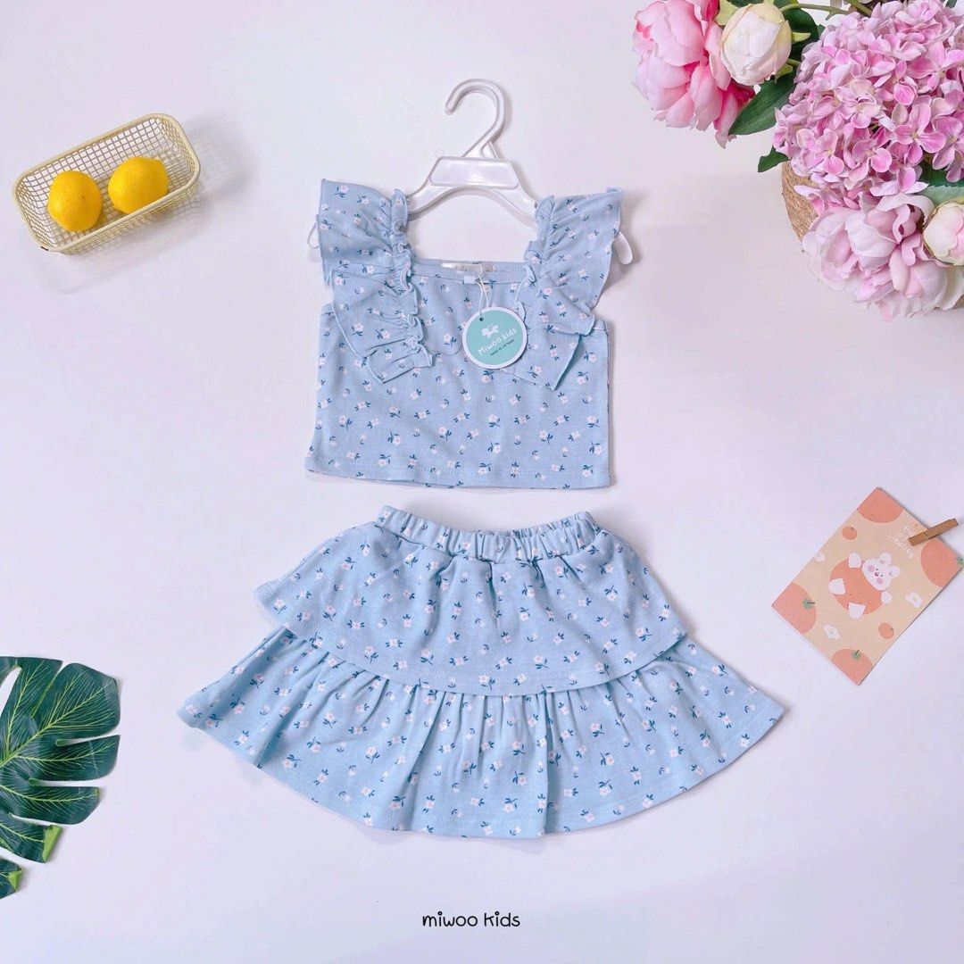 Terno for toddler (Category: Sets or Coordinates) located in Manila. Submitted by rosalyncar33942 (Listing ID 1466620828, Image 1). Description: - Brand: Miwoo Kids (Tag still attached) - Set includes: Sleeveless crop top with ruffled shoulders and tiered elastic-waist skirt - Perfect for: Toddlers and little girls - Available prints/colors: Blue floral, pink polka dot, purple stars, and multicolored floral - Condition: Brand new.