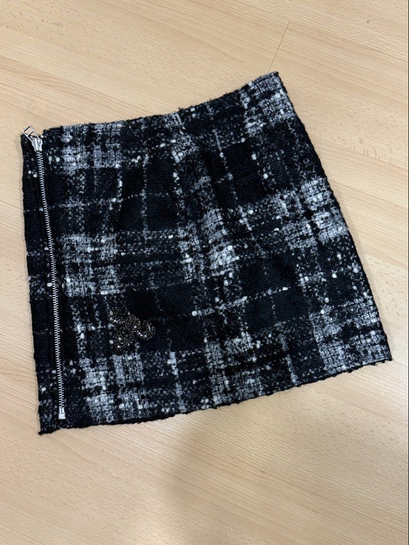 The Kooples Plaid Mini Skirt (Category: Skirts) located in Muntinlupa City. Submitted by alexisofia (Listing ID 1466736515, Image 2). Description: Chic Parisian tweed mini skirt in black and white plaid knit with silver exposed side zip detail and a delicate beaded/rhinestone embellishment near the hem. Purchased in Paris & good for winter ❄️ like new / excellent condition (worn only a few times) small (FR 36 / US 2-4 / EU 36) 43% Wool, 35% Acryl