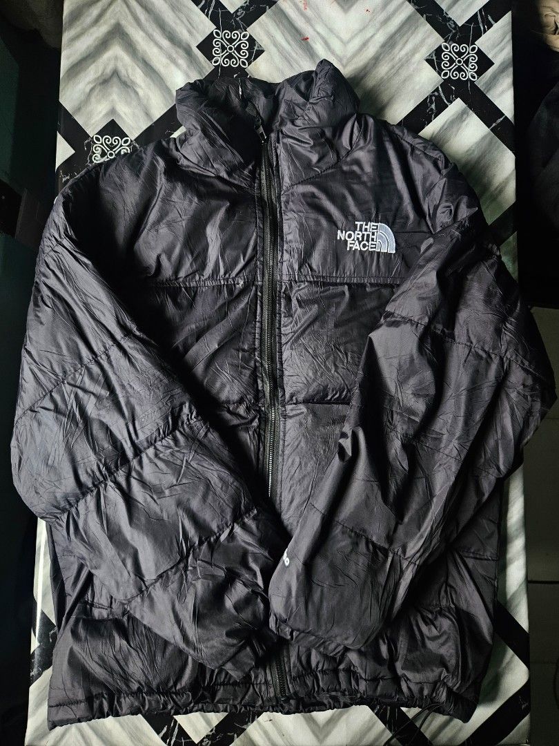 The North Face 700 Down Puffer Jacket Black (Category: Coats, Jackets and Outerwear) located in Manila. Submitted by shanshan.river (Listing ID 1466592829, Image 1). Description: - Brand: The North Face - Color: Classic Black - Insulation: 700 Fill Power (super warm & lightweight) - Details: Iconic white embroidered logo on chest and back shoulder - Features: Full zip front closure & quilted design - Condition: Great cold weather outerwear - Ship