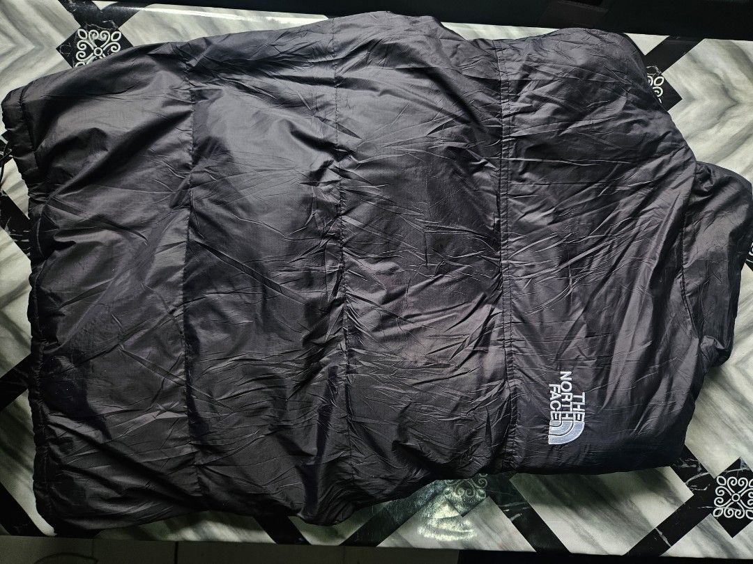 The North Face 700 Down Puffer Jacket Black (Category: Coats, Jackets and Outerwear) located in Manila. Submitted by shanshan.river (Listing ID 1466592829, Image 3). Description: - Brand: The North Face - Color: Classic Black - Insulation: 700 Fill Power (super warm & lightweight) - Details: Iconic white embroidered logo on chest and back shoulder - Features: Full zip front closure & quilted design - Condition: Great cold weather outerwear - Ship