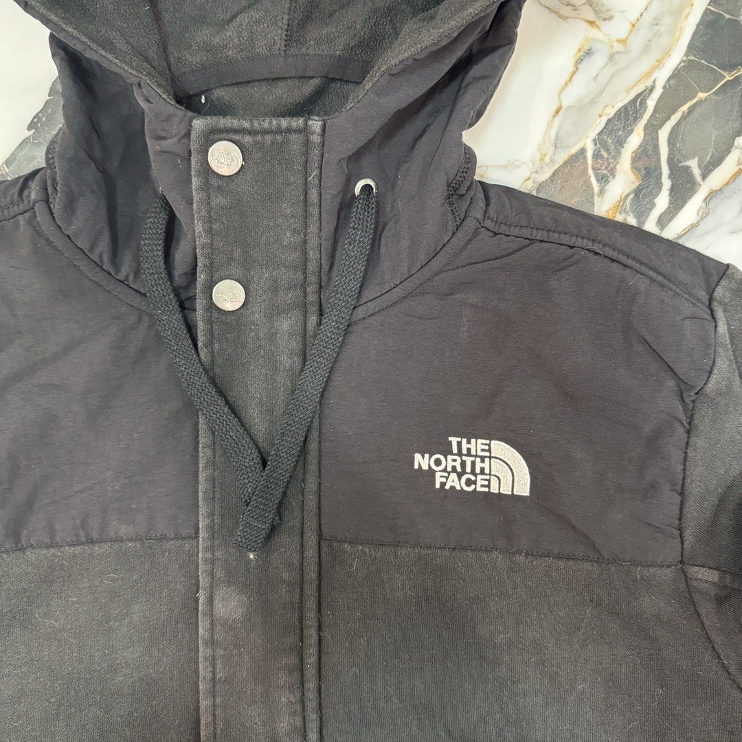 The North Face Black Hooded Jacket Size S (Category: Coats, Jackets and Outerwear) located in Manila. Submitted by fastflip.ph (Listing ID 1466726702, Image 2). Description: - Brand: The North Face - Color: Classic Black - Size: S (Made in Vietnam) - Closure: Full zip with additional snap buttons - Features: Drawstring hood, front pockets, ribbed cuffs and hem - Branding: White embroidered logo on the chest and back shoulder.