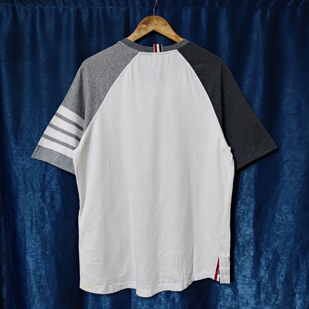 THOM BROWNE 4-BAR RAGLAN TEE (Category: Tshirts & Polo Shirts ) located in Makati City. Submitted by upcycled.closeth (Listing ID 1466609514, Image 2). Description: - Authentic Thom Browne product - White & Gray, short sleeve - Size: Large (men's) - Like new - Authentic - flaws: no flaws - Excellent condition - Need wash, fresh from bale - Features design of Thom Browne 4 bar design tee - Material: 100% cotton !!STILL NEGOTIABLE!!.