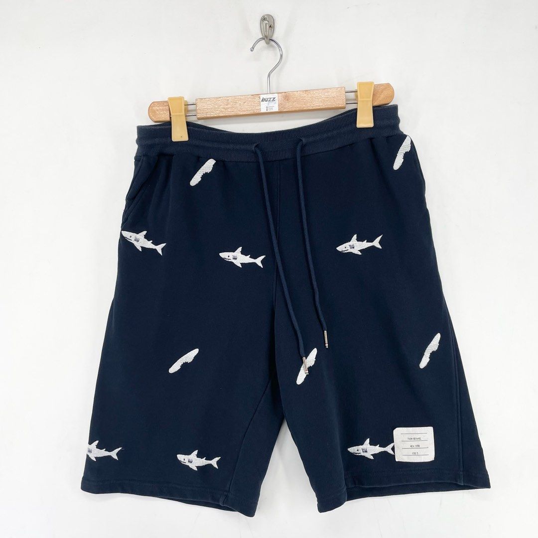 Thom Browne Embroidered Shark Sweat Shorts (Category: Shorts) located in Manila. Submitted by buzz.garments (Listing ID 1466700069, Image 1). Description: Size: 2 on tag Dimensions(inches) -Waist/Width: 30”-40” (Strechable) -Hip: 21” -Front Rise: 13” -Thigh: 11” -Inseam: 10” -Outseam/Length : 21” -Leg Opening: 11” - color may vary due to lighting. please manage your expectations-minimal and unseen flaws must be considered..