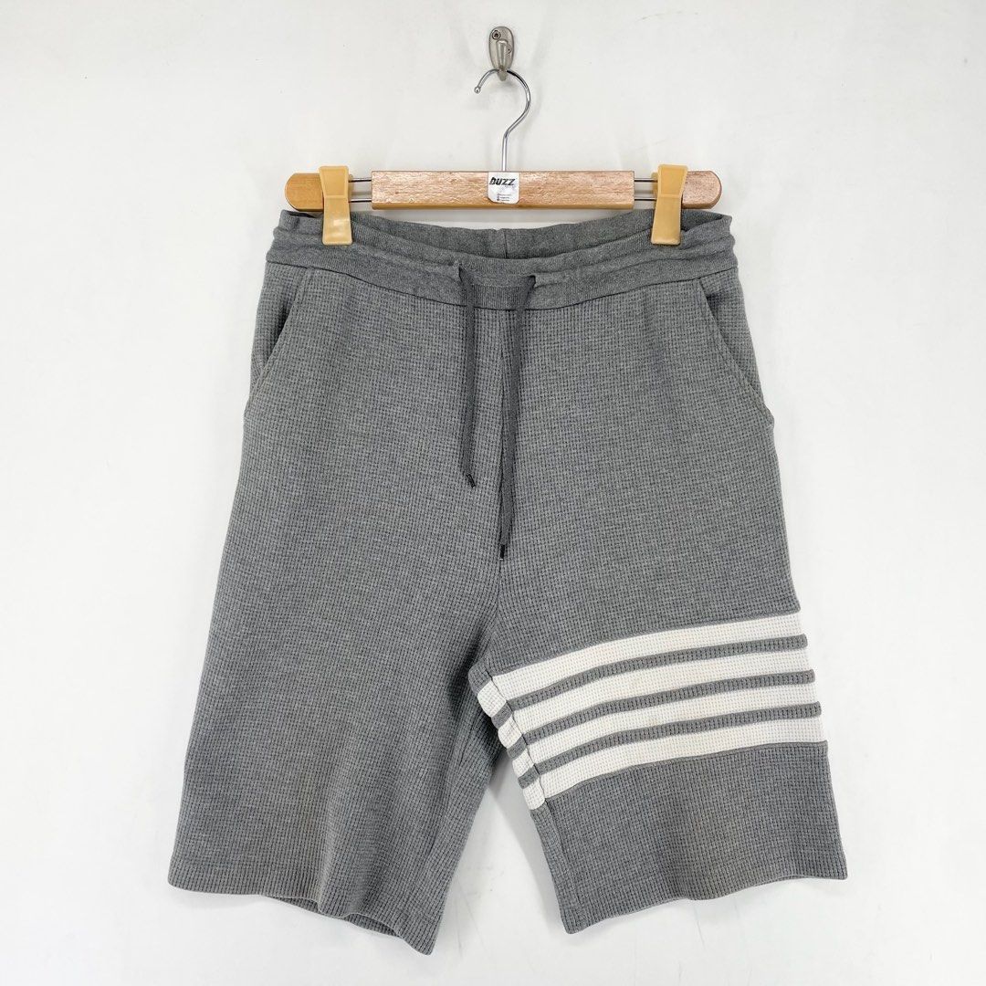 Thom Browne Waffle 4-Bar Classic Sweat Shorts (Category: Shorts) located in Manila. Submitted by buzz.garments (Listing ID 1466696232, Image 1). Description: Size: 2 on tag Dimensions(inches) - Waist/Width: 30”-40” (Strechable) - Hip: 20” - Front Rise: 15” - Thigh: 11” - Inseam: 10” - Outseam/Length : 22” - Leg Opening: 10” removable stain need wash - color may vary due to lighting. please manage your expectations-minimal and unseen flaws must be