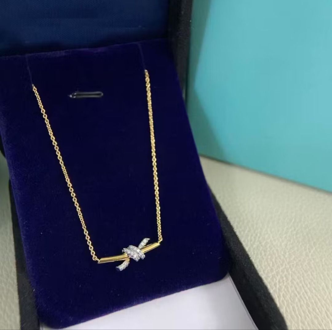tiffany knott necklace/ earrings (Category: Necklaces) located in Quezon City. Submitted by japanandsingaporeluxepreloved (Listing ID 1466771746, Image 2). Description: .