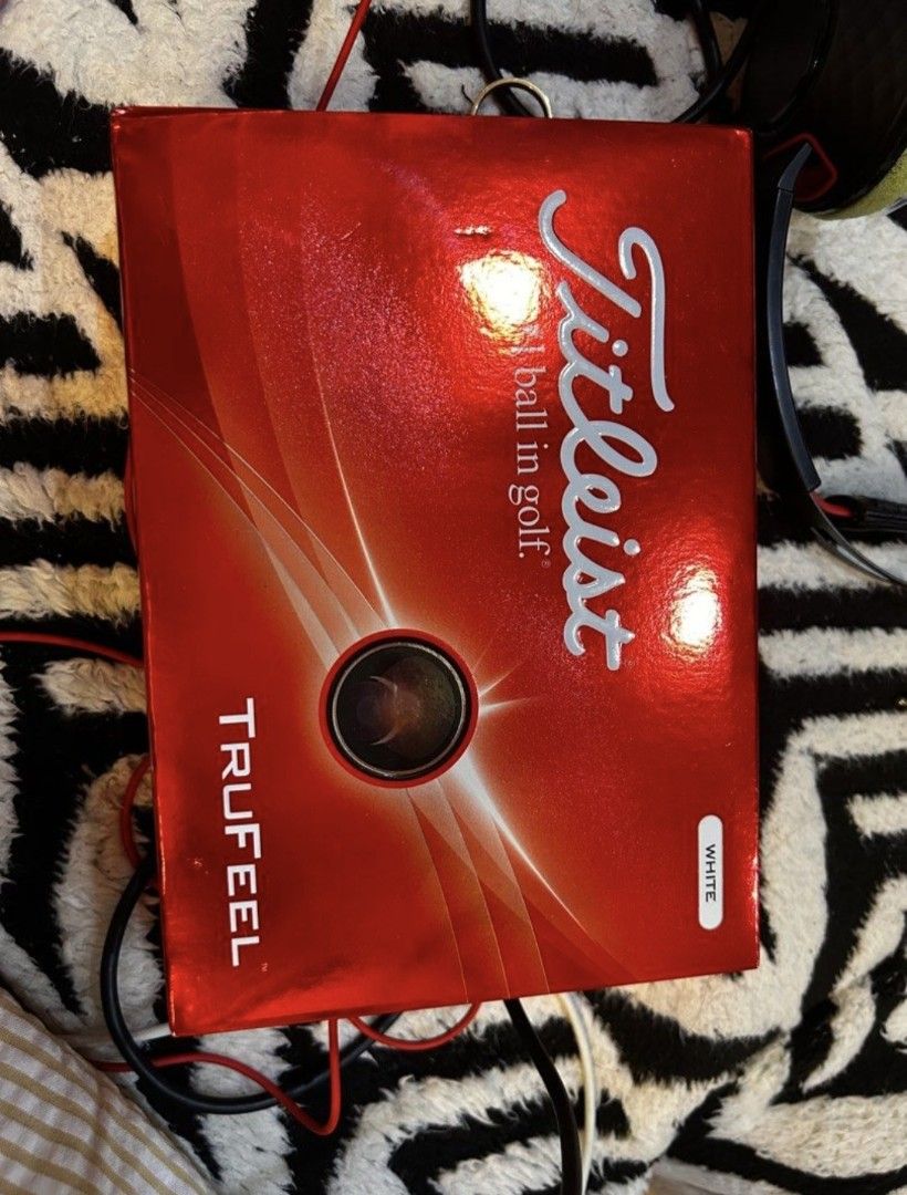 Titleist TruFeel White Golf Balls Box (Category: Golf) located in Manila. Submitted by rylansstuff (Listing ID 1466623151, Image 2). Description: - Brand: Titleist - Model: TruFeel (T6036S) - Color: White - Quantity: 12 golf balls total - Packaging: 4 inner packs inside the main red box - Condition: Brand new, never opened, and securely packed.