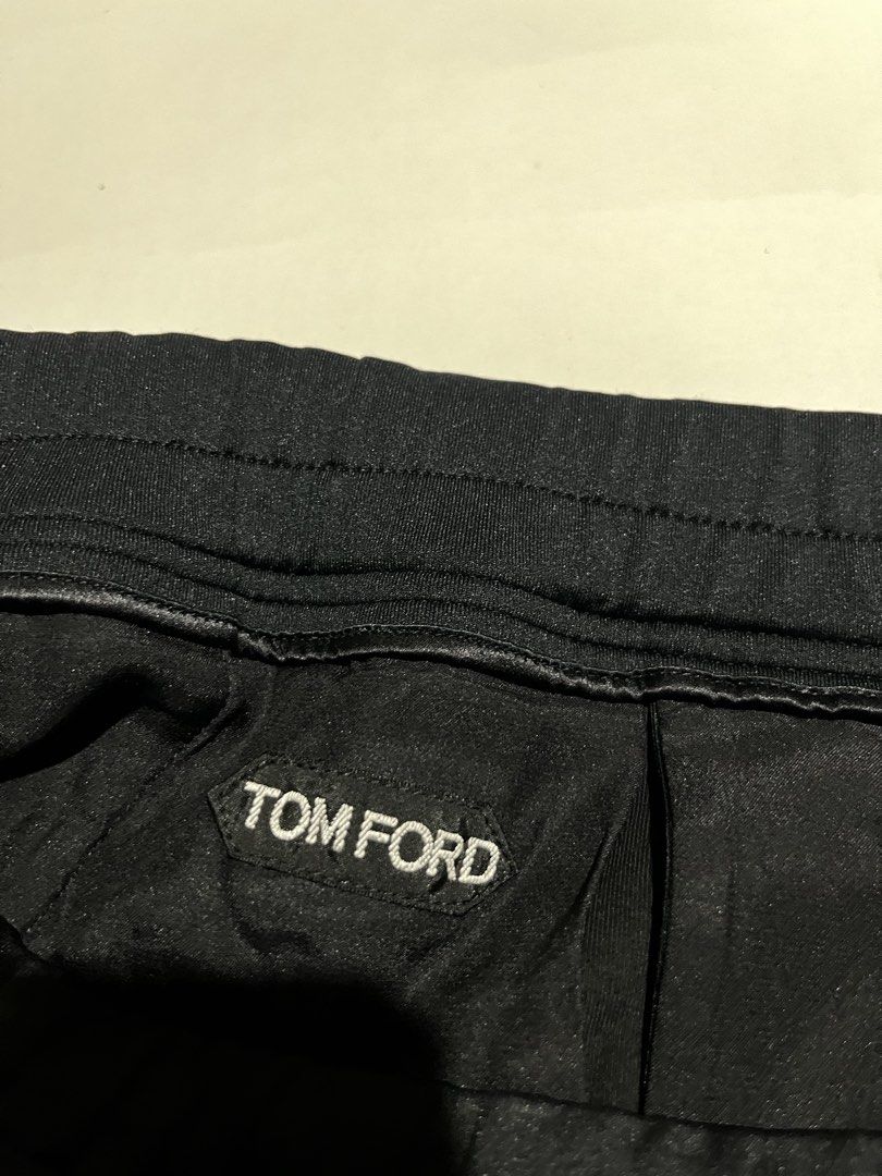 Tom Ford Black Sweatpants Joggers with Zips (Category: Joggers) located in Dumangas. Submitted by chiiieeef (Listing ID 1466563728, Image 3). Description: - Brand: Tom Ford - Color: Black - Style: Luxury streetwear sweatpants with front creases - Material: Premium Made-in-Italy blend of polyester, cotton, and polyurethane - Hardware: Metal-tipped drawstrings and engraved snap buttons on back pocket - Details: Signature white brand label, luxuriou