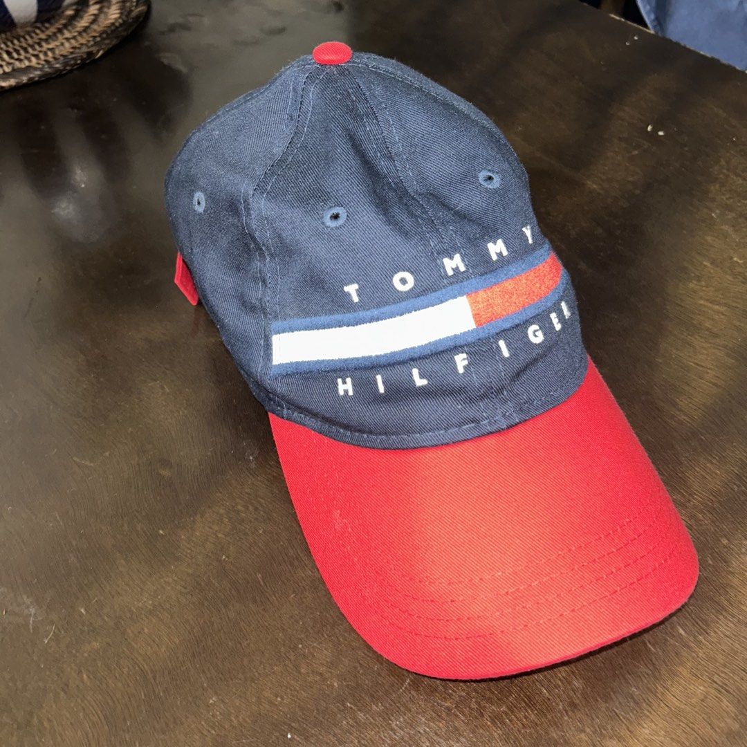 Tommy Hilfiger Navy Blue and Red Baseball Cap (Category: Caps & Hats) located in Manila. Submitted by tortangtalong67 (Listing ID 1466744462, Image 2). Description: Pre-loved Tommy Hilfiger two-tone baseball cap in great condition .