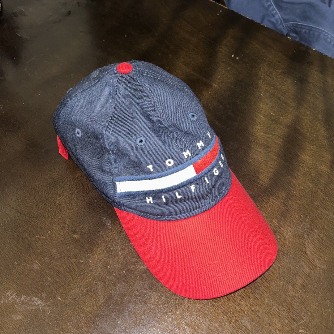 Tommy Hilfiger Navy Blue and Red Baseball Cap (Category: Caps & Hats) located in Manila. Submitted by tortangtalong67 (Listing ID 1466744462, Image 3). Description: Pre-loved Tommy Hilfiger two-tone baseball cap in great condition .