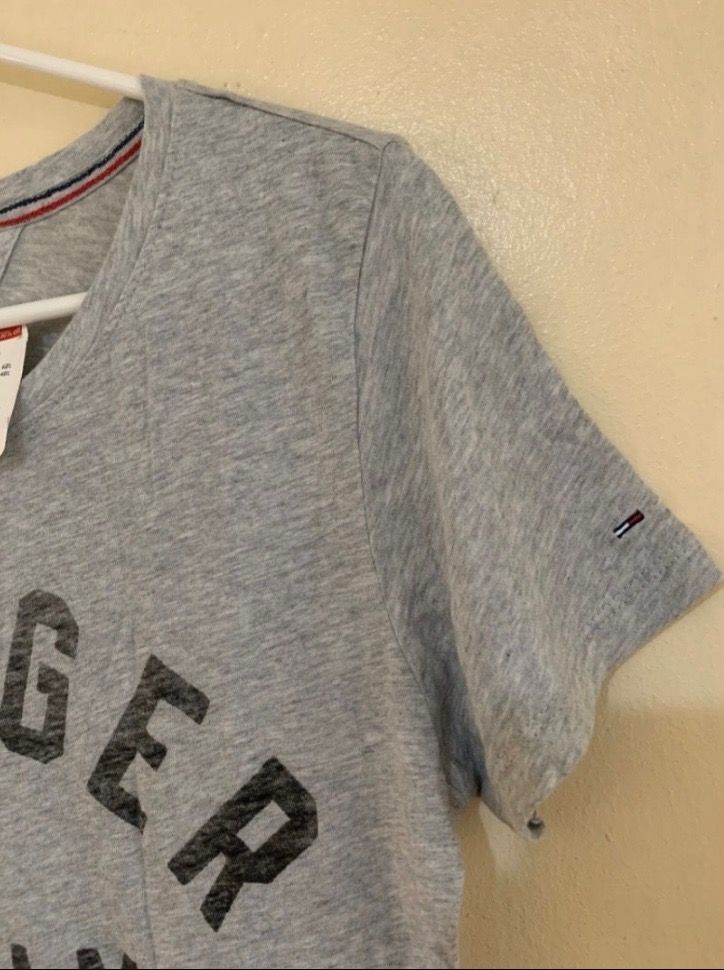 Tommy Hilfiger Tshirt Womens (Category: Shirts) located in Valenzuela. Submitted by clickandshoppreloved (Listing ID 1466625392, Image 2). Description: Tommy Hilfiger Tshirt Womens SRP NT1680 | PHP 3K Sale Price 995 Onhand, Original Brandew Large Ontag, (28L x 16.5W) Color : Grey.