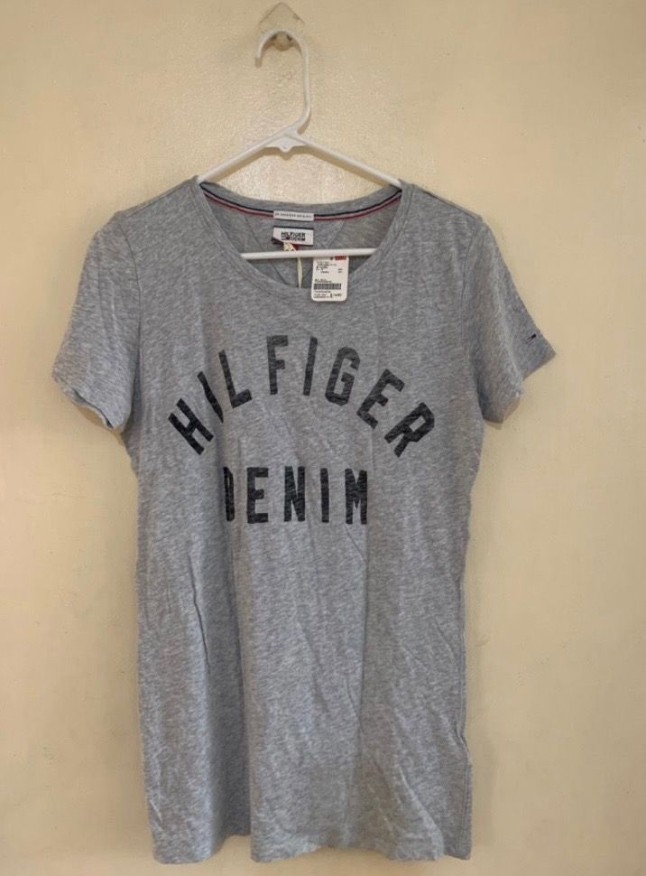 Tommy Hilfiger Tshirt Womens (Category: Shirts) located in Valenzuela. Submitted by clickandshoppreloved (Listing ID 1466625392, Image 1). Description: Tommy Hilfiger Tshirt Womens SRP NT1680 | PHP 3K Sale Price 995 Onhand, Original Brandew Large Ontag, (28L x 16.5W) Color : Grey.