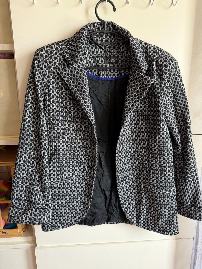 Topshop Black and White Patterned Blazer UK 6 (Category: Coats, Jackets and Outerwear) located in Quezon City. Submitted by bubspreloved (Listing ID 1466645331, Image 1). Description: - Brand: Topshop - Size: UK 6 / EUR 34 / US 2 - Pattern: Black and white geometric - Details: Fully lined with contrast blue trim, classic lapel collar, and structured shoulders - Condition: Great pre-loved condition - Style: Perfect for office wear, smart casual ou
