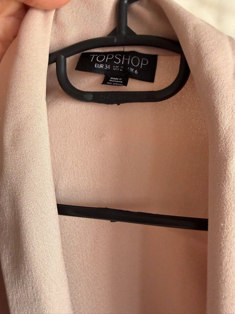 Topshop Pale Pink Blazer Jacket Size UK 6 (Category: Coats, Jackets and Outerwear) located in Quezon City. Submitted by bubspreloved (Listing ID 1466701092, Image 2). Description: - Brand: Topshop - Color: Pale Pink - Size: EUR 34 / US 2 / UK 6 - Design: Open front style with a self-tie waist belt and long sleeves - Fabric: Lightweight, great for layering - Occasion: Perfect for work or going out.