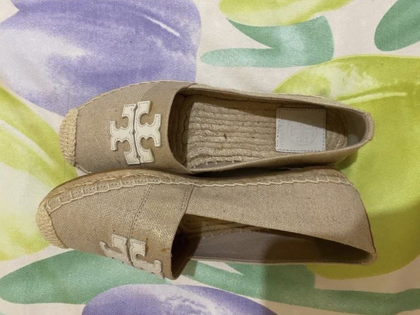 Tory Burch Canvas Espadrilles Beige Flat Shoes (Category: Flats & Sandals) located in Paranaque City. Submitted by chelleann12 (Listing ID 1466567139, Image 2). Description: - Brand: Tory Burch - Style: Slip-on canvas espadrilles - Color: Beige - Details: Iconic logo applique, woven jute midsole, branded leather insoles, textured rubber outsole - Condition: Clean canvas uppers, light interior wear near the heel - Perfect for: Casual daytime wear 